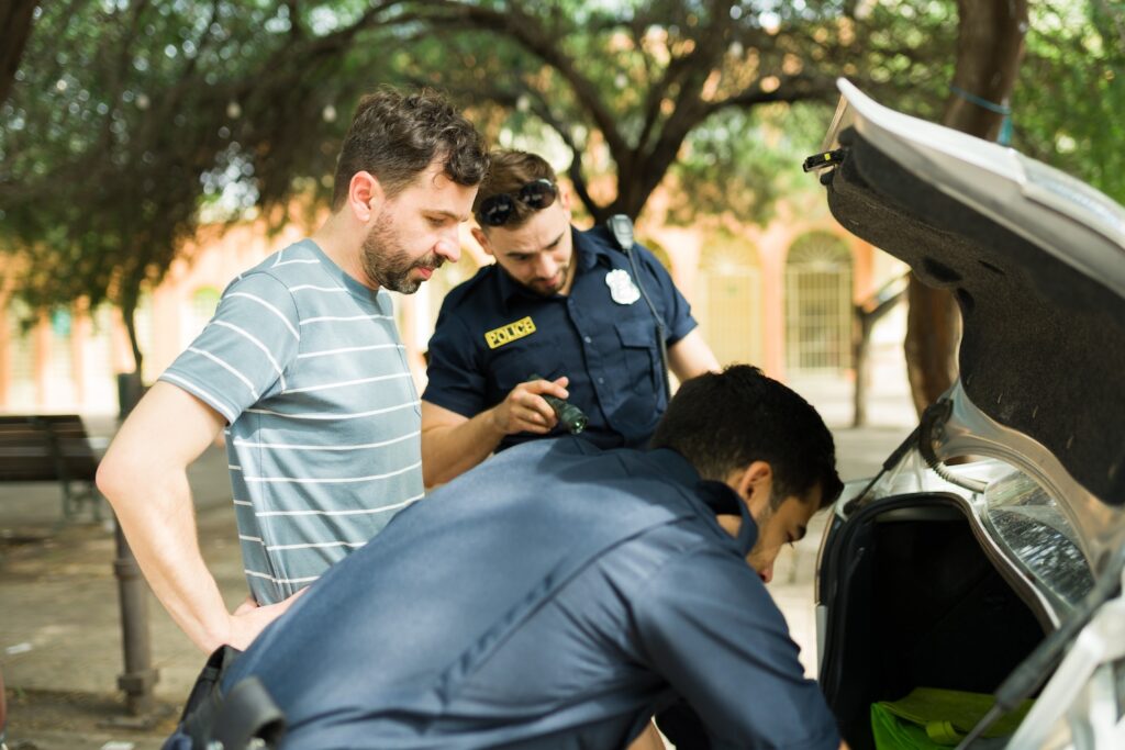Police agents searching man's vehicle for criminal evidence - Handling an outstanding warrant - Air Capital Bail Bonds